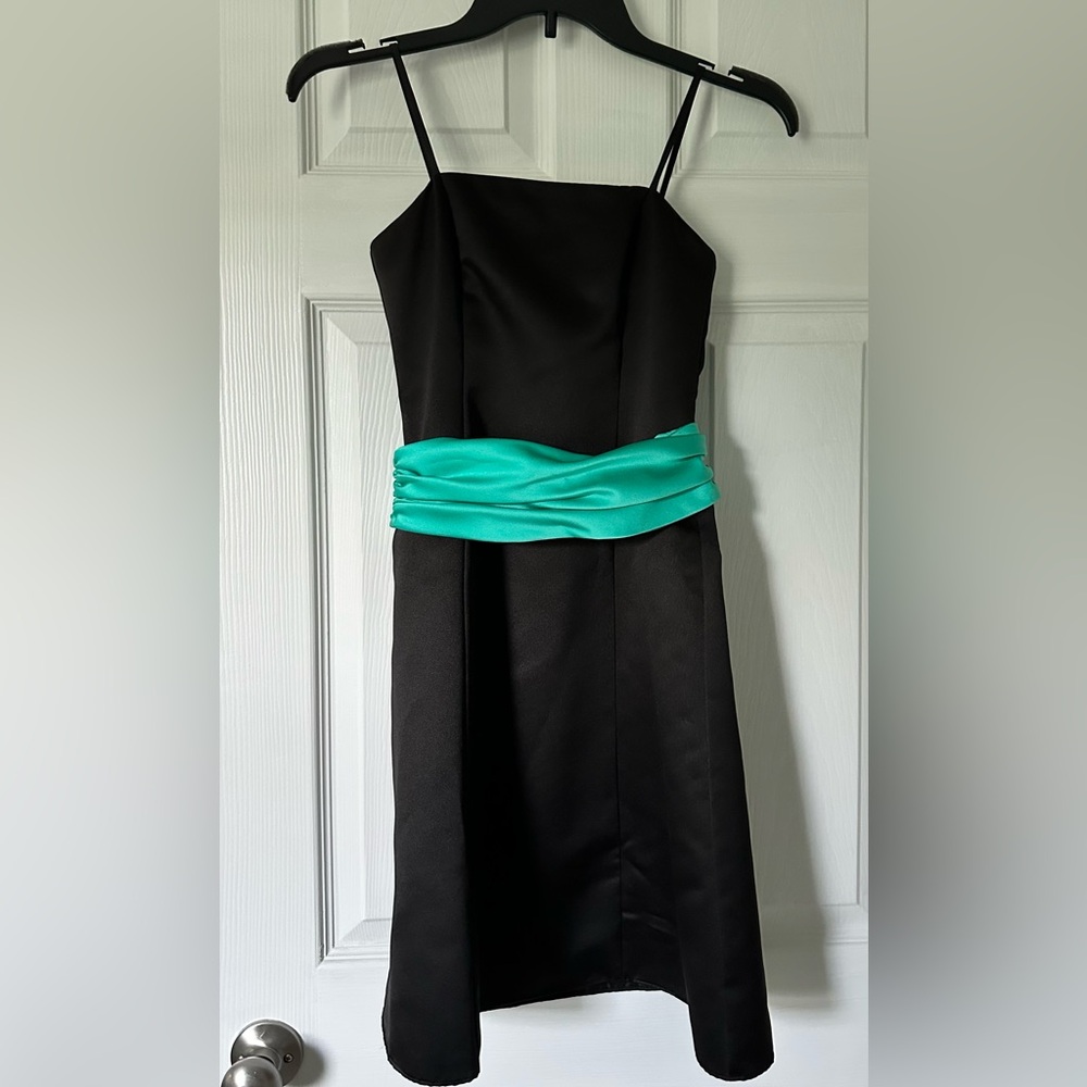 Elegant Black Dress with Teal Accent